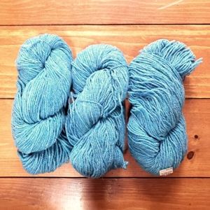 9 skeins of 100% pure wool worsted weight yarn bright blue